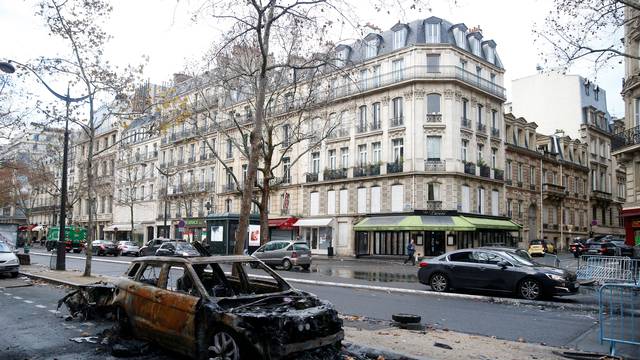 A vandalized car is seen the morning after clashes with protesters wearing yellow vests, a symbol of a French drivers' protest against higher diesel taxes, in Paris