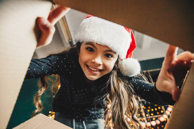 Surprised,Cute,Child,Girl,Opening,A,Christmas,Present.,Little,Kid