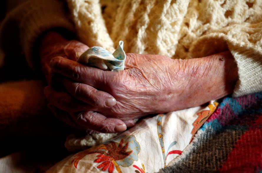 Emma Morano, thought to be the world's oldest person and the last to be born in the 1800s, sits on her bed during her 117th birthday in Verbania