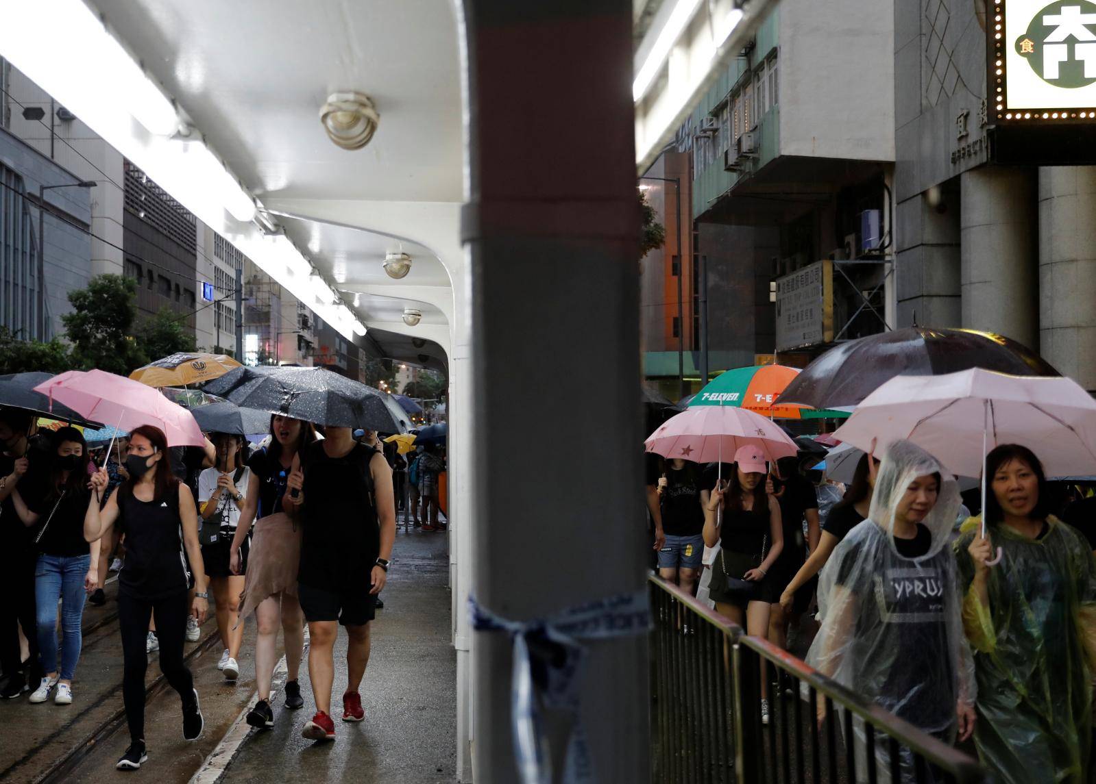 People march during a rally to demand democracy and political reforms in Hong Kong