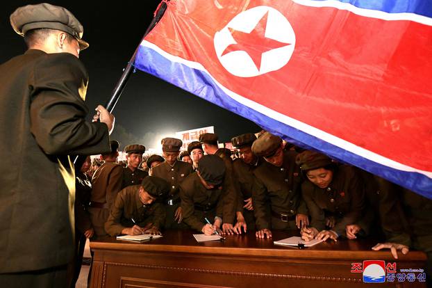 Young people, including students and youth league officials, sign petitions to join or return to the army this week, according to North Korean state media, at an undisclosed location in North Korea