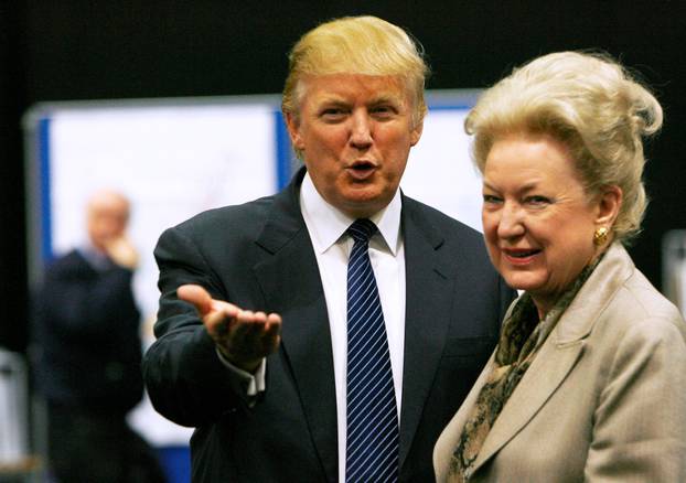 FILE PHOTO: Donald Trump gestures as he stands next to his sister Maryanne Trump Barry, during a break in proceedings of the Aberdeenshire Council inquiry into his plans for a golf resort, Aberdeen