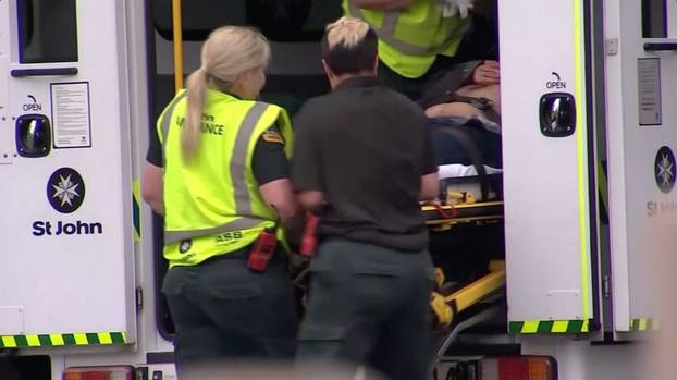 Video grab of emergency services personnel transport a stretcher carrying a person at a hospital, after reports that several shots had been fired, in central Christchurch