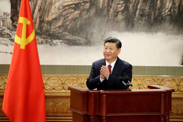 FILE PHOTO: Chinese President Xi Jinping claps after his speech as China