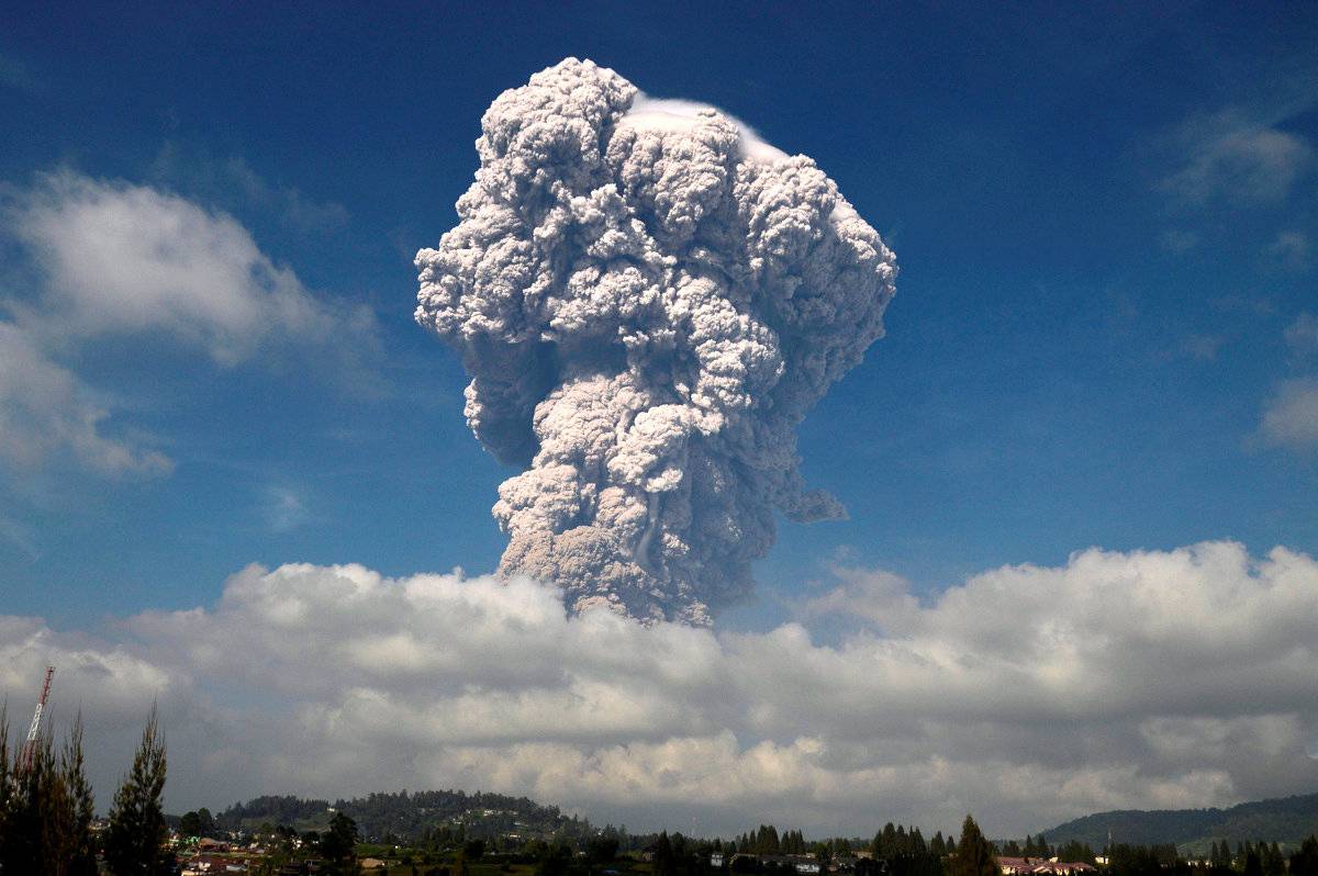 Ash from Mount Sinabung volcano rises to an approximate height of 5,000 meters during an eruption in Karo, North Sumatra, Indonesia