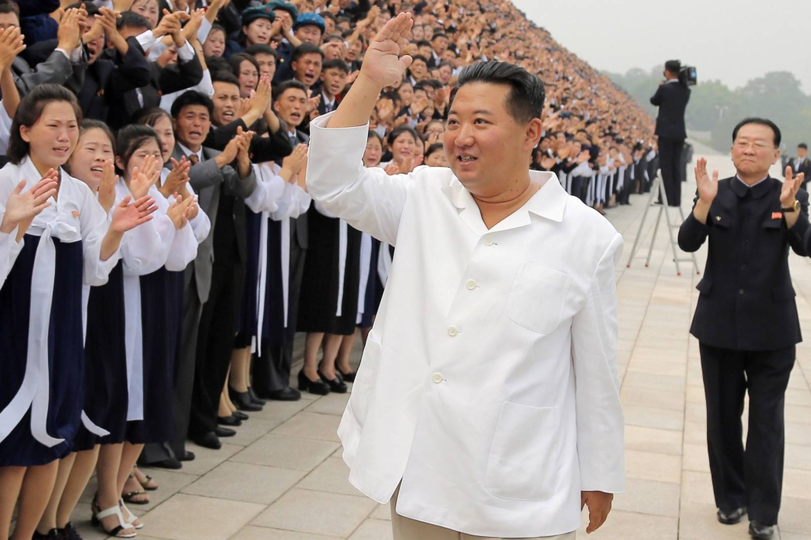 North Korean leader Kim Jong Un attends a photo session with participants during Youth Day celebrations, in Pyongyang