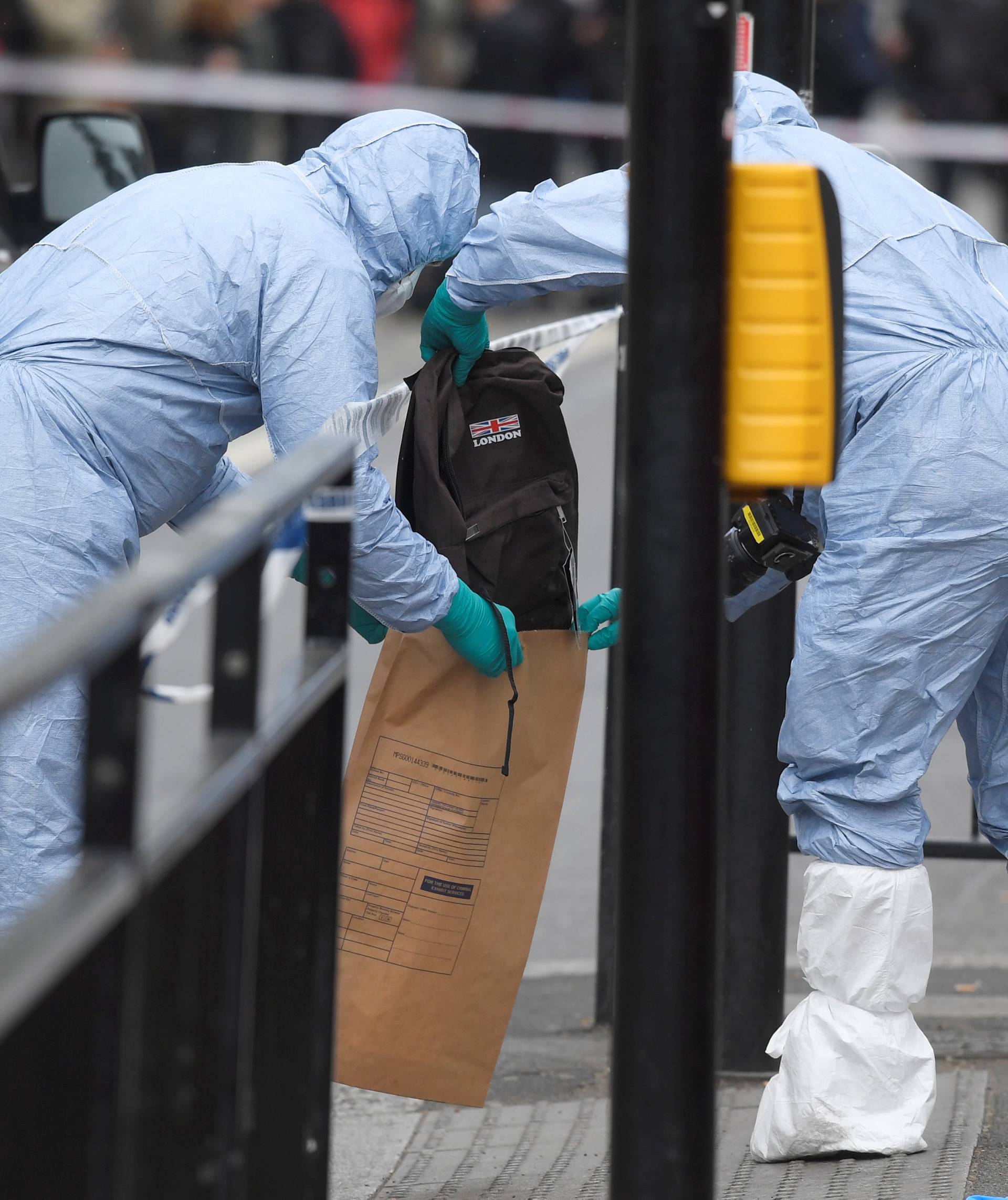 Forensic investigators recover a rucksack after man was arrested on Whitehall in Westminster in central London