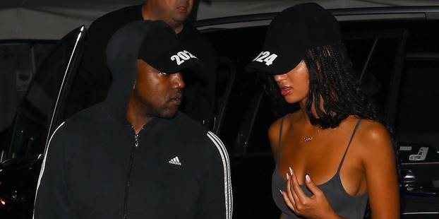 *PREMIUM-EXCLUSIVE* Kanye West is back on the dating scene as he arrives at a clothing factory with a mystery woman both wearing 2024 hats! **WEB EMBARGO UNTIL 9:30 PM ET on October 10, 2022**