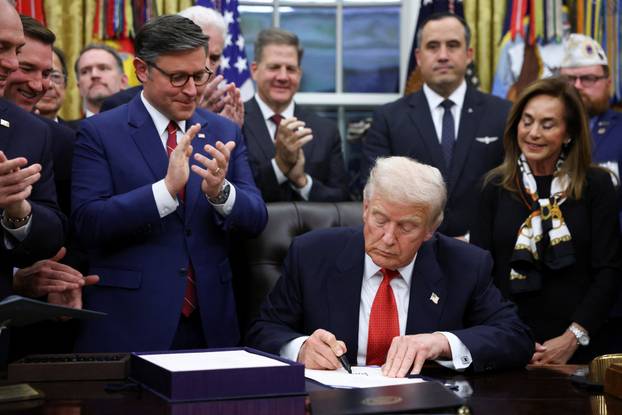 U.S. President Trump signs the funding bill to end the government shutdown, in Washington, D.C.