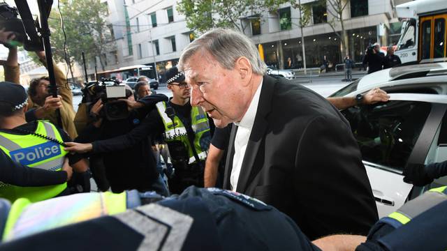 Cardinal George Pell arrives at the Melbourne Magistrates Court in Melbourne