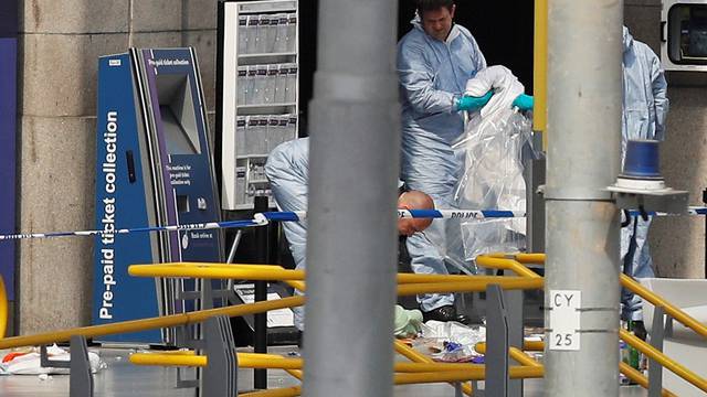 Forensics investigators work at the Manchester Arena in Manchester