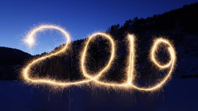 The numbers "2019" are written in the air with a sparkler near a tourist camp outside Krasnoyarsk