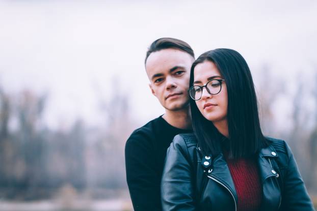 man and woman near the river autumn