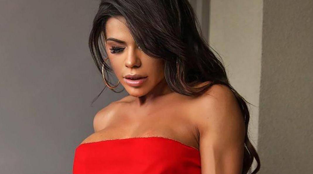 Festive Fantasy! Miss BumBum Suzy Cortez strips down to a red ribbon as she gets into the Christmas spirit.