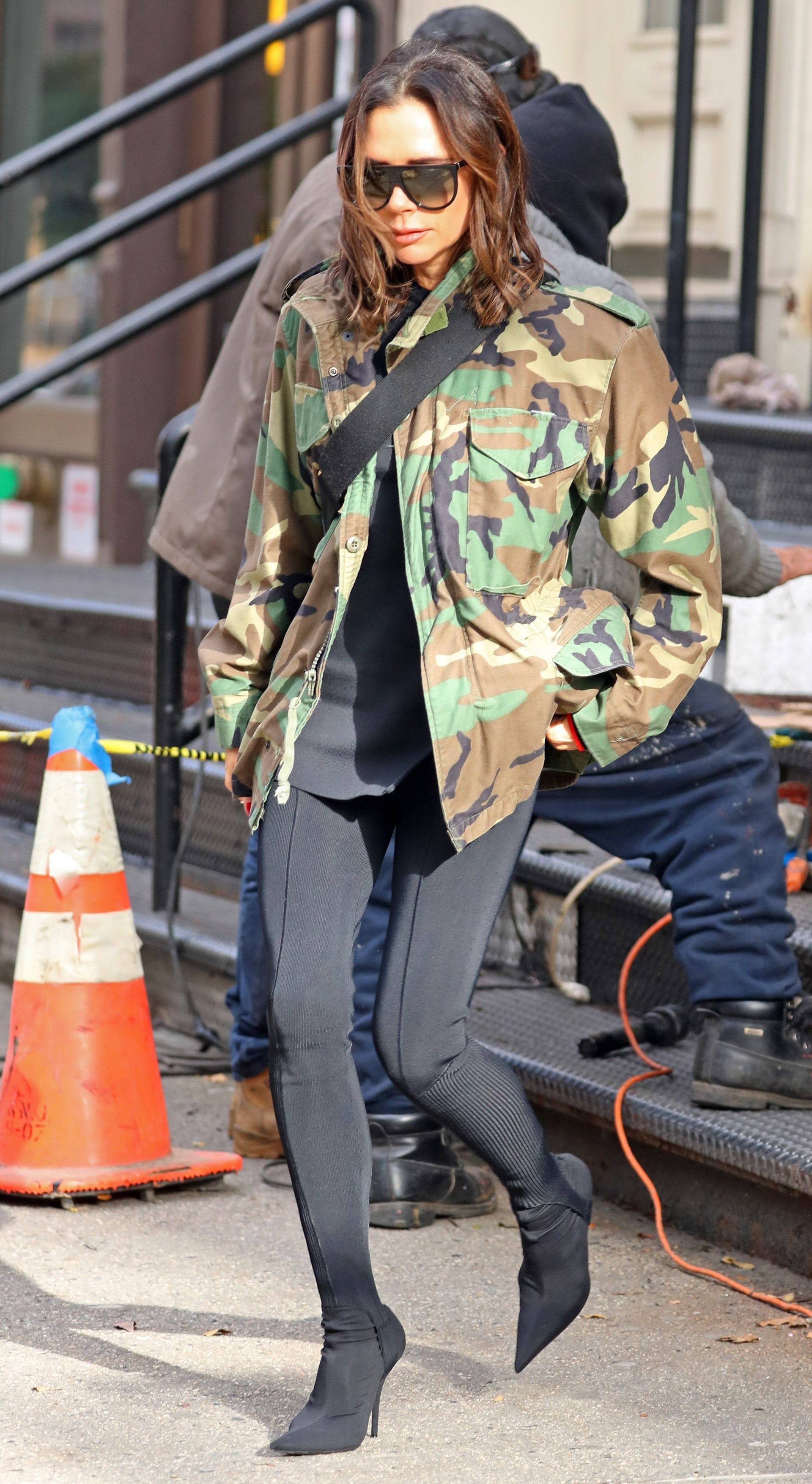 Victoria Beckham steps out wearing a camouflage military jacket and black tights, NYC
