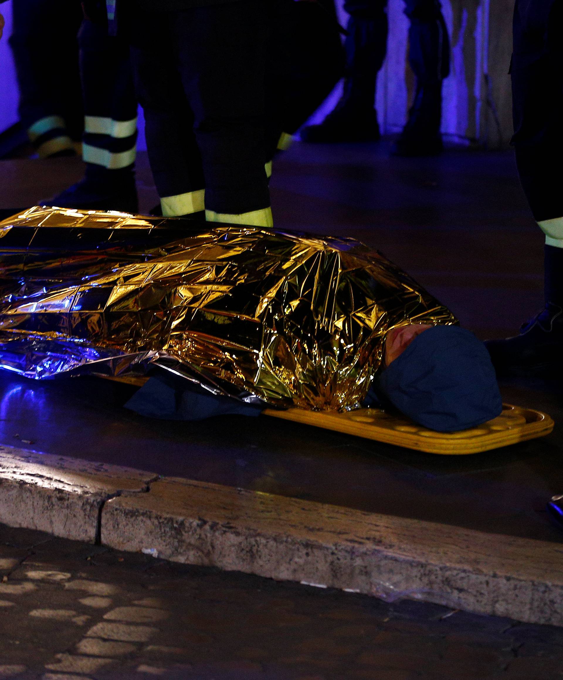 An injured person is seen outside the underground where some of CSKA Moscow supporters were injured in Rome