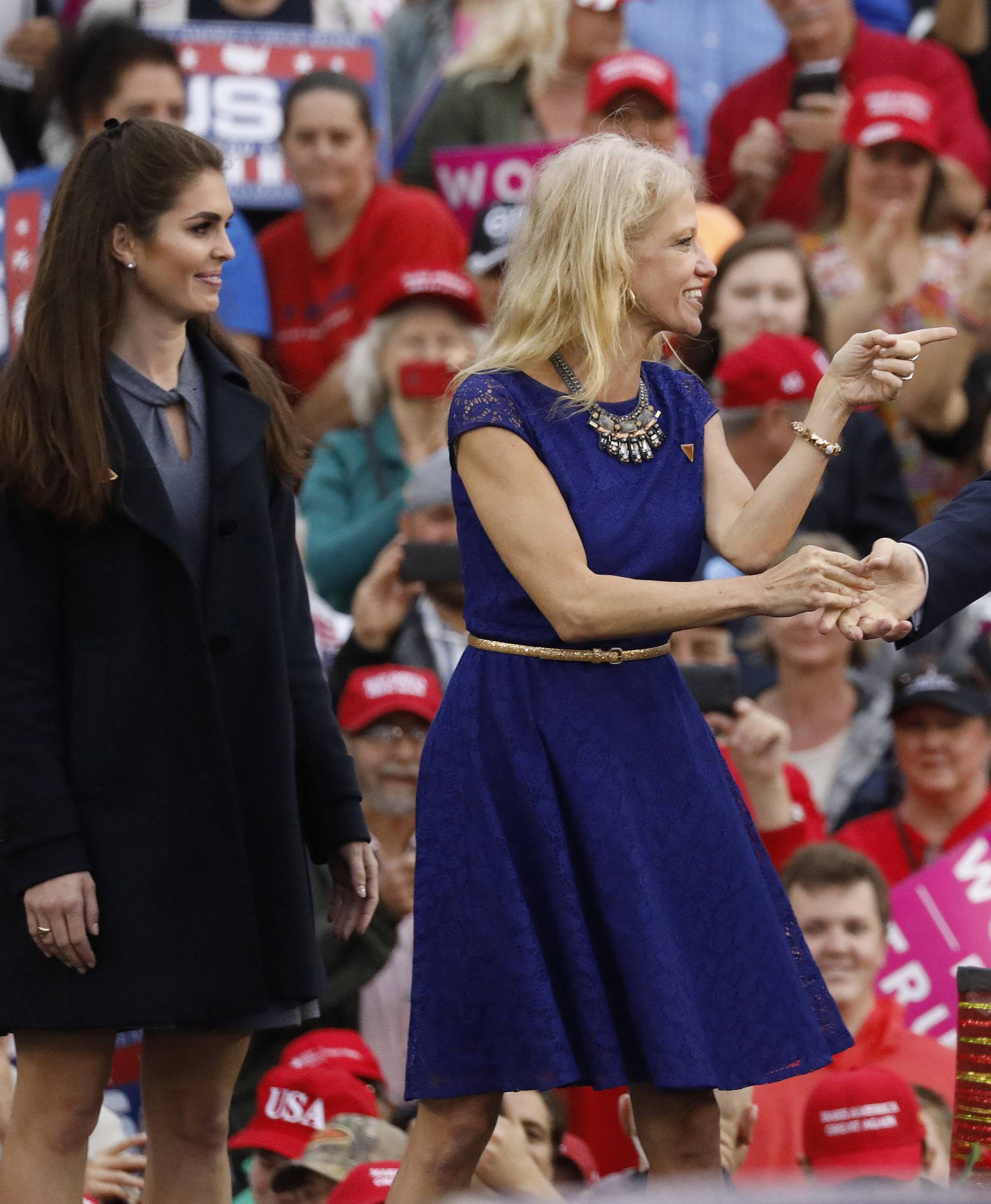 U.S. President-elect Donald Trump greets campaign manager and senior advisor, Kellyanne Conway, and Campaign Communications Director Hope Hicks during a USA Thank You Tour event in Mobile, Alabama