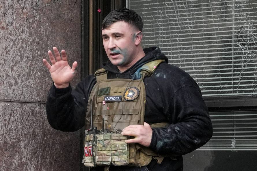 People attend the "March Against Minnesota Fraud" in Minneapolis