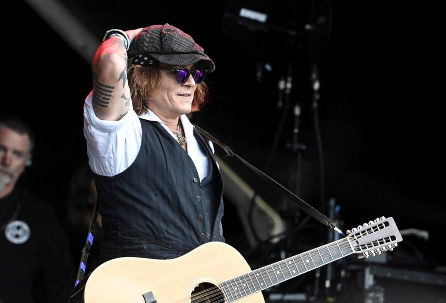 Actor Johnny Depp performs with musician Jeff Beck, in Helsinki