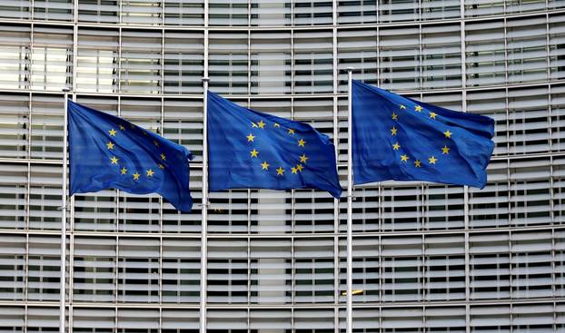FILE PHOTO: EU flags flutter outside the EU Commission headquarters in Brussels