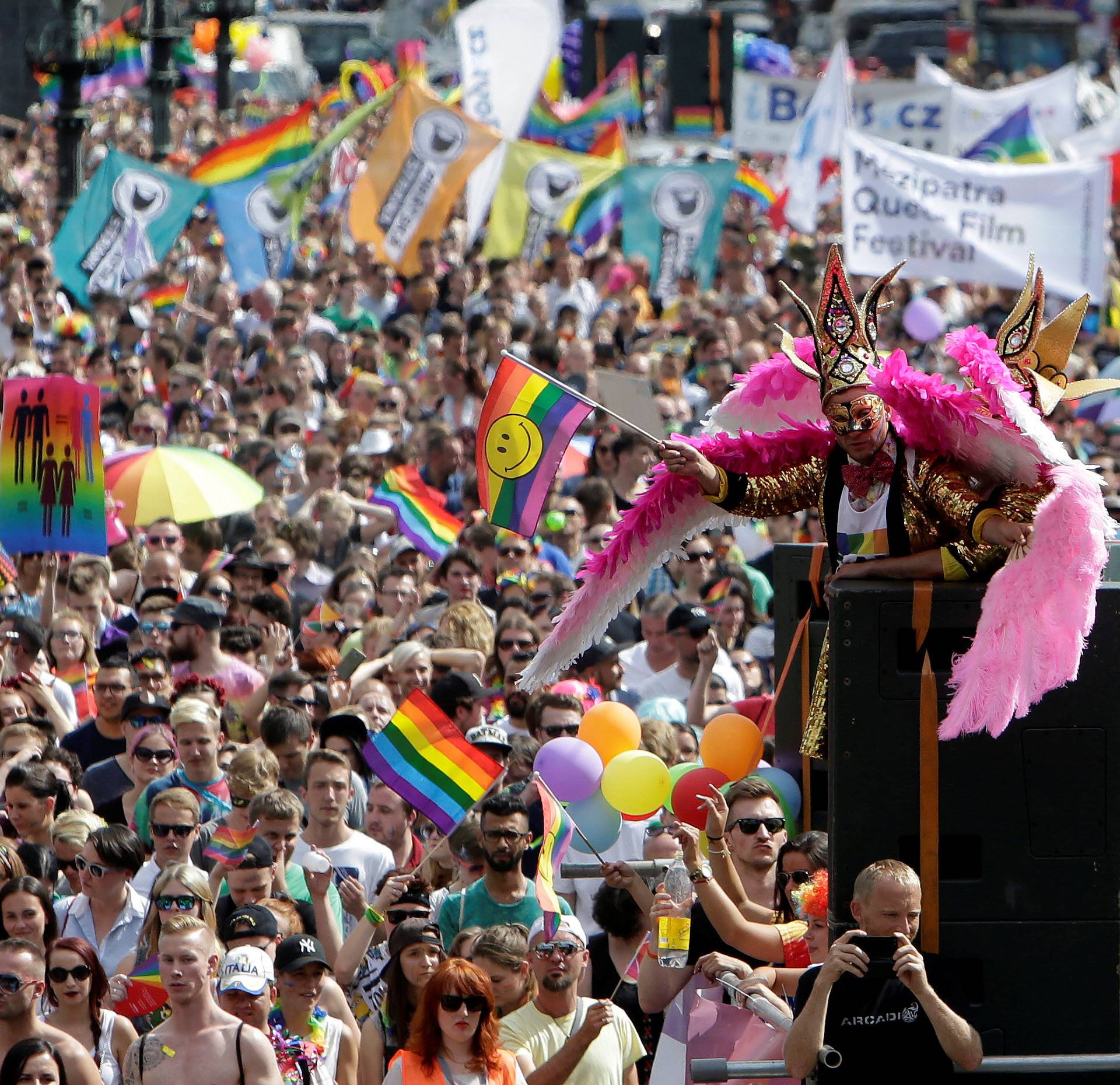 Participants hold rainbow flags during the Prague Pride Parade where thousands marched through the city centre in support of gay rights, in Czech Republic