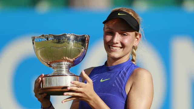 Croatia's Donna Vekic celebrates winning the final with the trophy