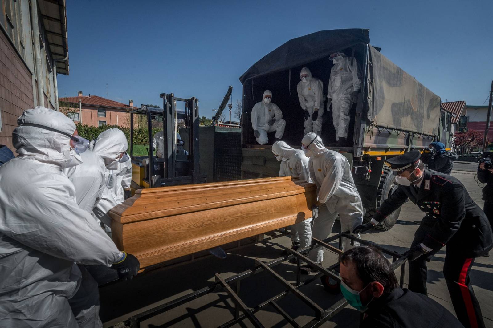 San Pietro bridge. Military and medical personnel of the Army together with the Carabinieri transport the coffins with the use of six trucks from a depot in Ponte San Pietro due to emergency COVID19 Coronavirus