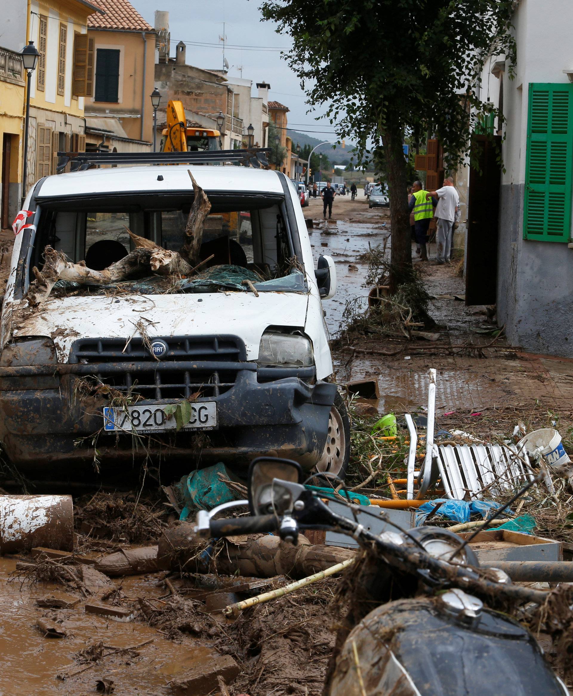 A destroyed car and debris are seen on the street as heavy rain and flash floods hit Sant Llorenc de Cardassar on the island of Mallorca
