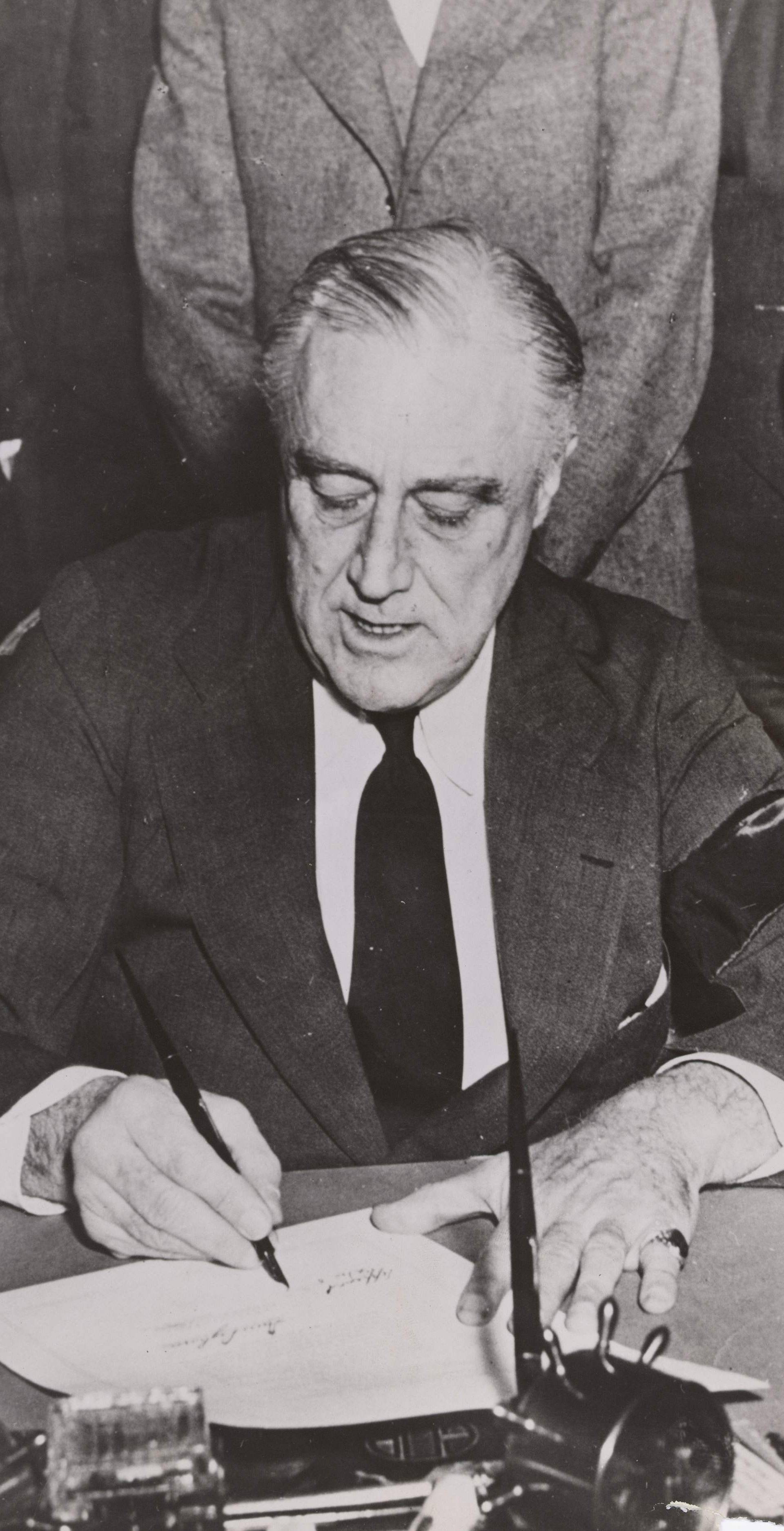 U.S. President Frankin Delano Roosevelt signs the declaration of war on Japan in Washington
