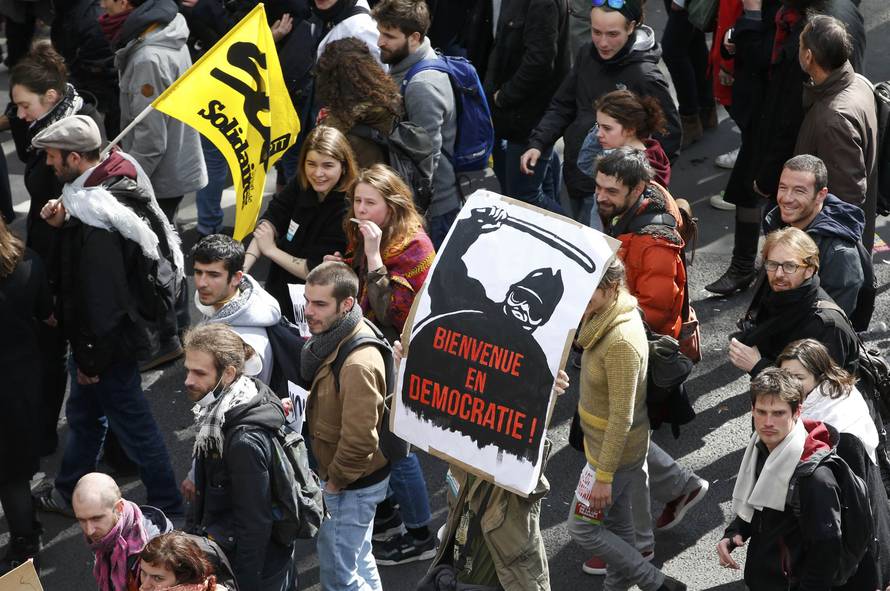 French labour union workers and students attend a demonstration against the French labour law proposal in Paris