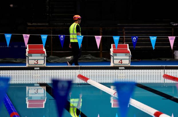 People work to prepare the Swimming venue, in Paris