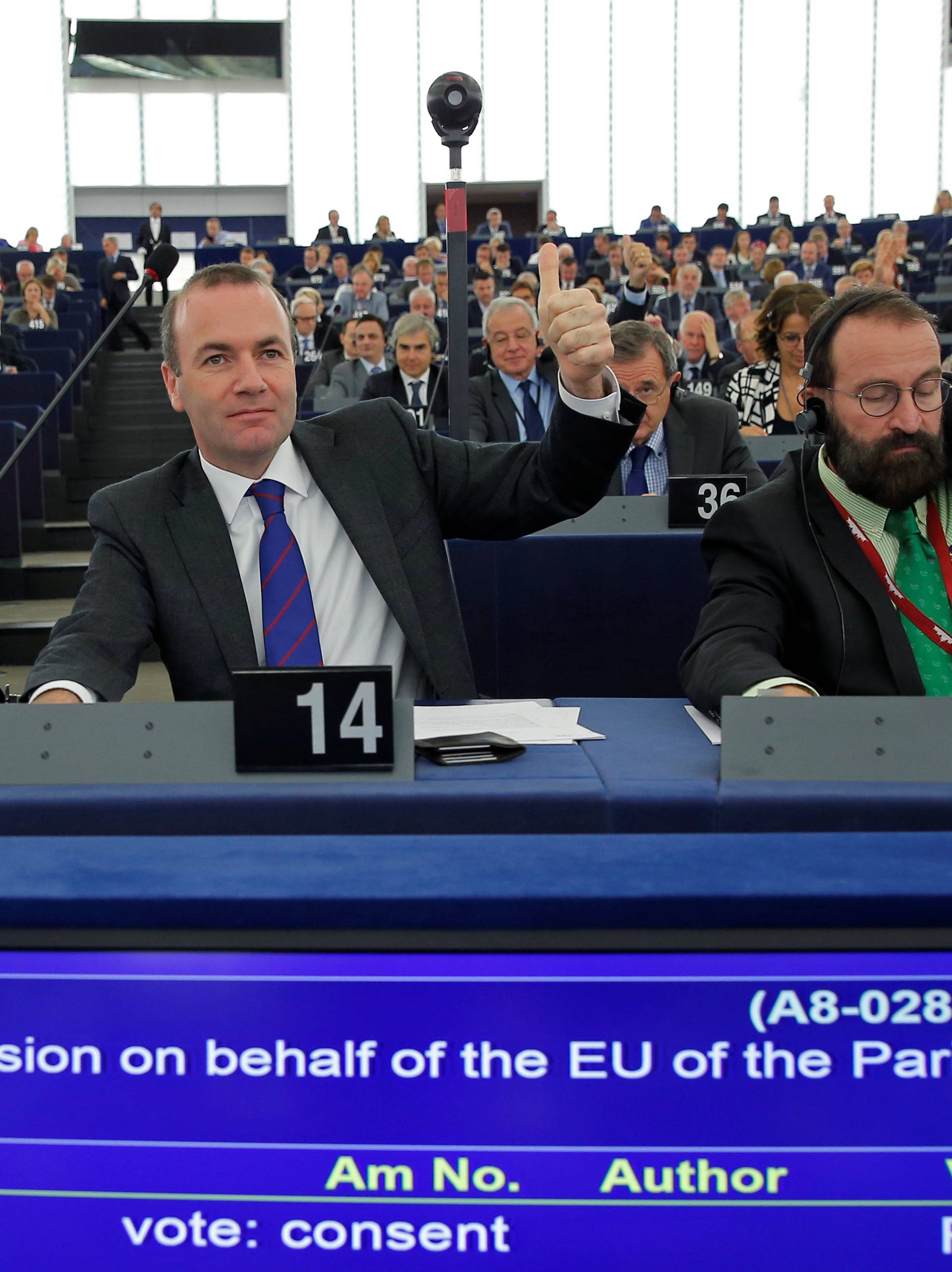 MEP's vote in favor of the Paris UN COP21 Climate Change agreement during a voting session at the European Parliament in Strasbourg
