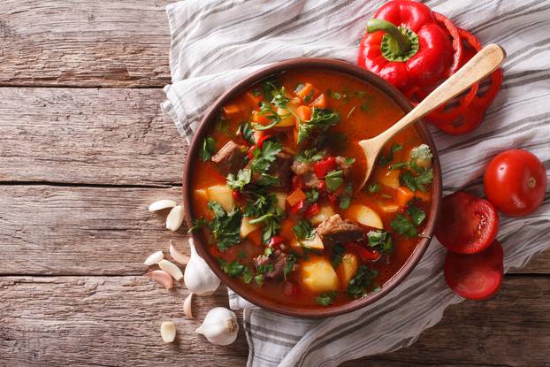 Tasty Hungarian goulash soup bograch and ingredients. horizontal