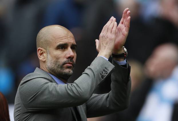 Manchester City manager Pep Guardiola applauds fans after the match