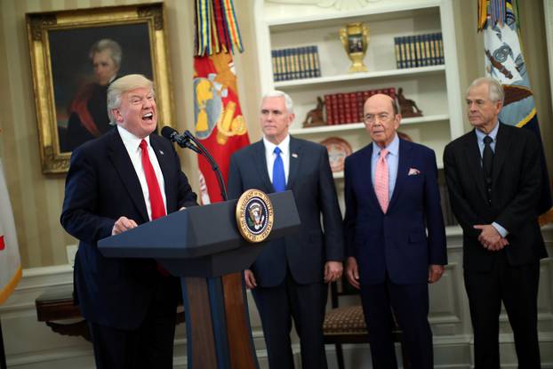 U.S. President Donald Trump speaks during a signing ceremony of executive orders on trade, accompanied by Vice President Mike Pence and U.S. Commerce Secretary Wilbur Ross at the Oval Office of the White House in Washington, U.S.