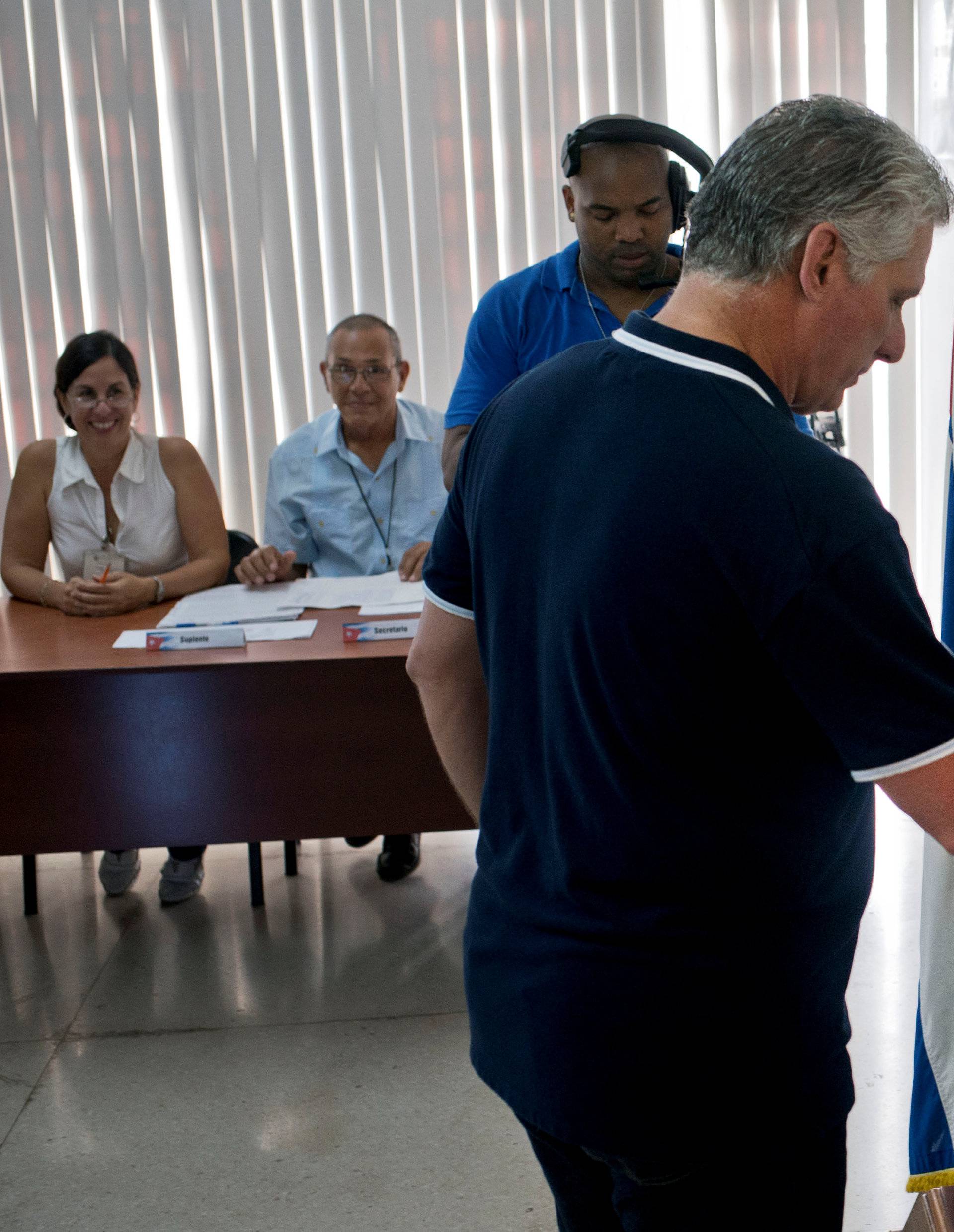 Cuba's President Miguel Diaz-Canel casts his vote during the referendum to approve the constitutional reform in Havana