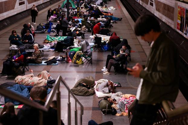 People take shelter during a Russian missile and drone strike, amid Russia's attack on Ukraine, in Kyiv