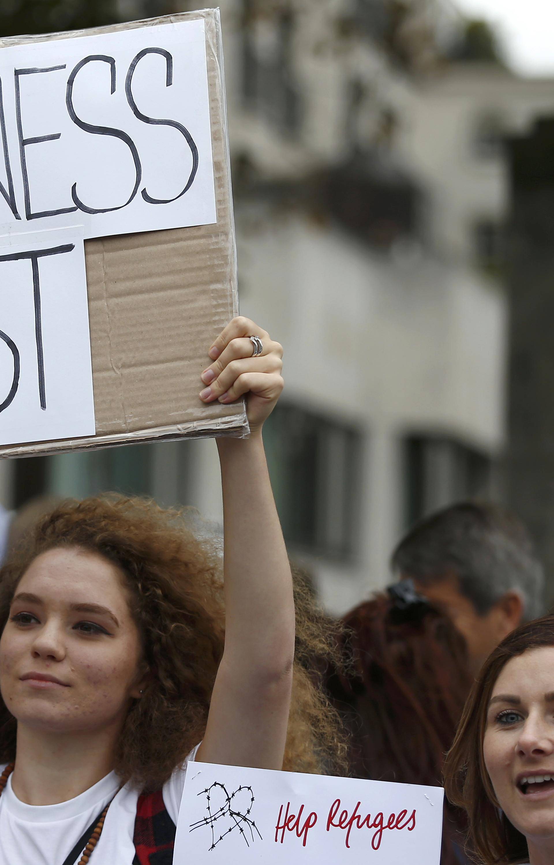 Demonstrators including refugees march to the Houses of Parliament during a protest in support of refugees, in London