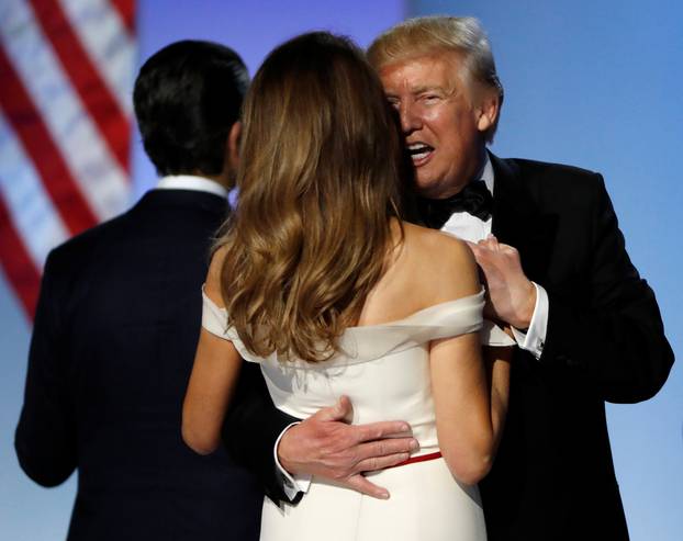 U.S. President Donald J. Trump hugs first lady Melania Trump as they attend the Inauguration Freedom Ball in Washington