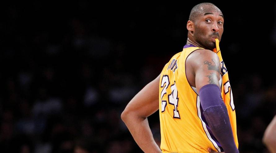 FILE PHOTO: Los Angeles Lakers' Bryant chews on his jersey during NBA game in Los Angeles