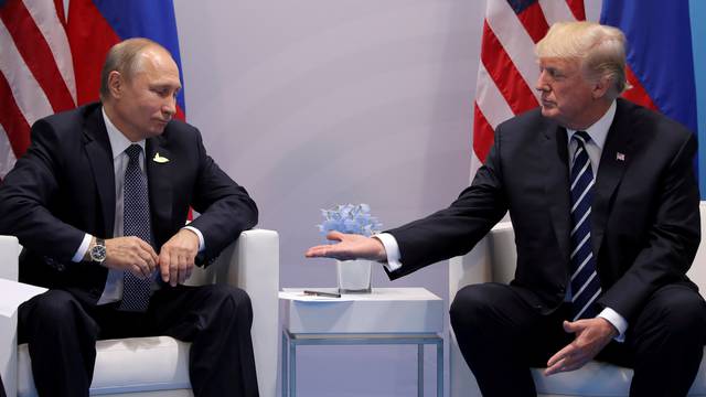 FILE PHOTO: U.S. President Donald Trump meets with Russian President Vladimir Putin during their bilateral meeting at the G20 summit in Hamburg