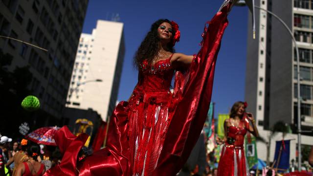 Revellers take part in the annual block party Cordao de Boitata during pre-carnival festivities in Rio de Janeiro