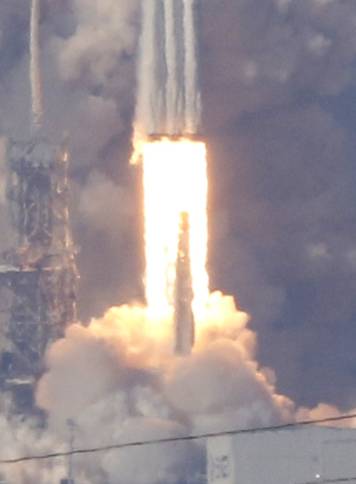 A SpaceX Falcon Heavy rocket lifts off from the Kennedy Space Center in Cape Canaveral