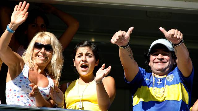 FILE PHOTO: Argentine soccer legend Maradona, his daughter Giannina and his ex-wife Villafane cheer for Boca Juniors in Buenos Aires