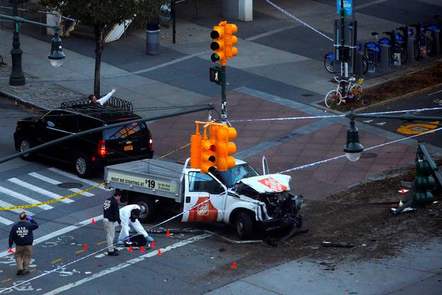 Police investigate a vehicle allegedly used in a ramming incident on the West Side Highway in Manhattan, New York.