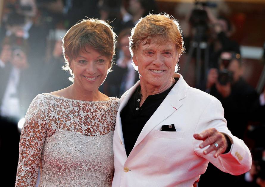 FILE PHOTO: Director Redford and wife Sibylle pose on red carpet during screening for movie "The Company You Keep" at 69th Venice Film Festival