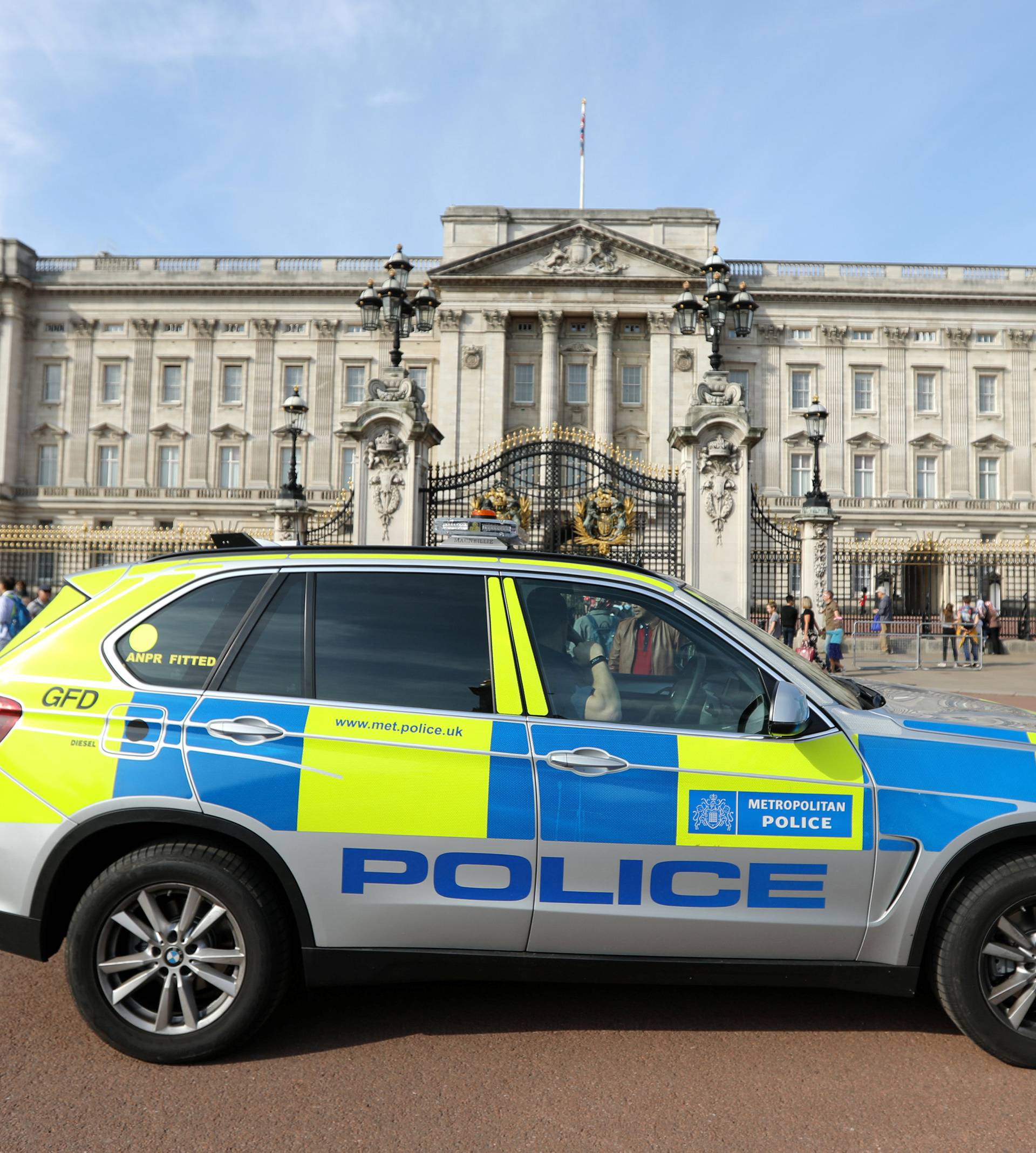 A police vehicle patrols outside Buckingham Palace in London