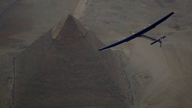 Solar Impulse 2, the solar powered plane, piloted by Swiss pioneer Andre Borschberg is seen during the flyover of the pyramids of Giza on July 13, 2016 prior to the landing in Cairo
