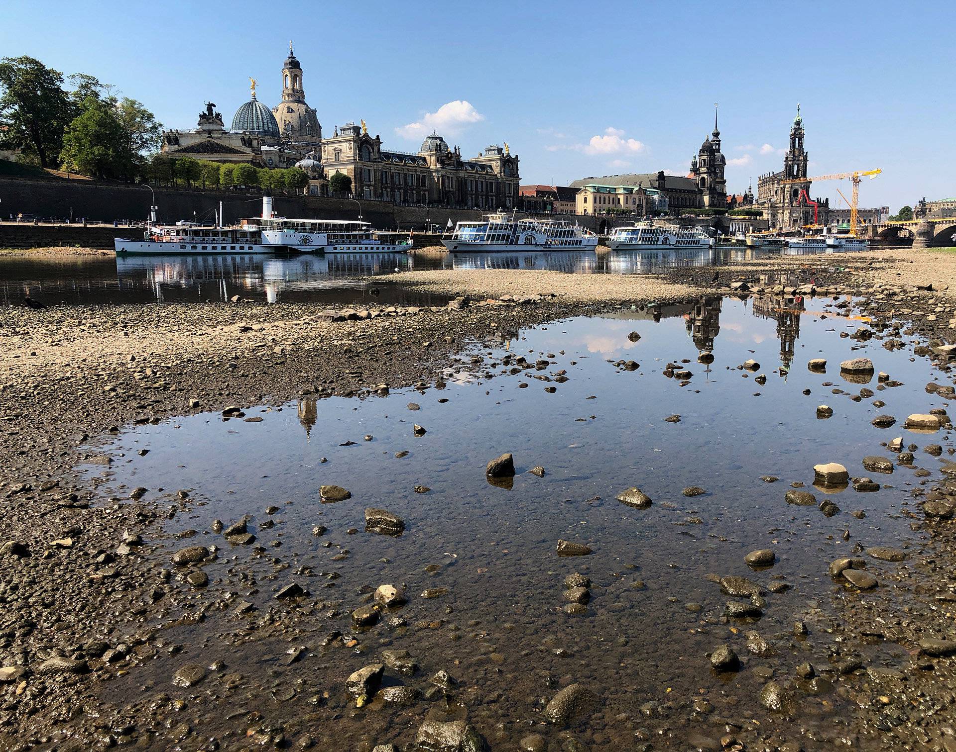 Sightseeing boats sit at the Elbe river in Dresden