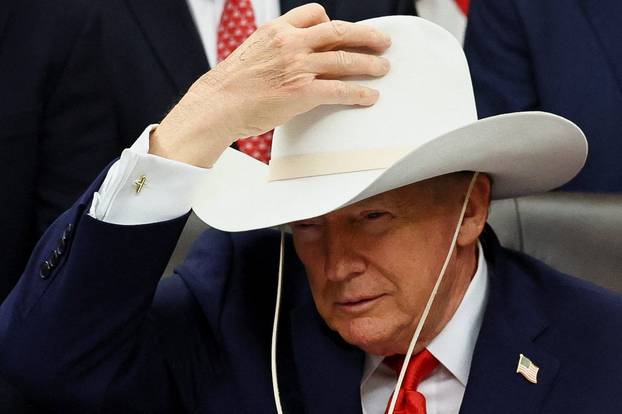 U.S. President Donald Trump signs a bill to award congressional gold medals to members of the 1980 U.S. Olympic men's hockey team, in Washington